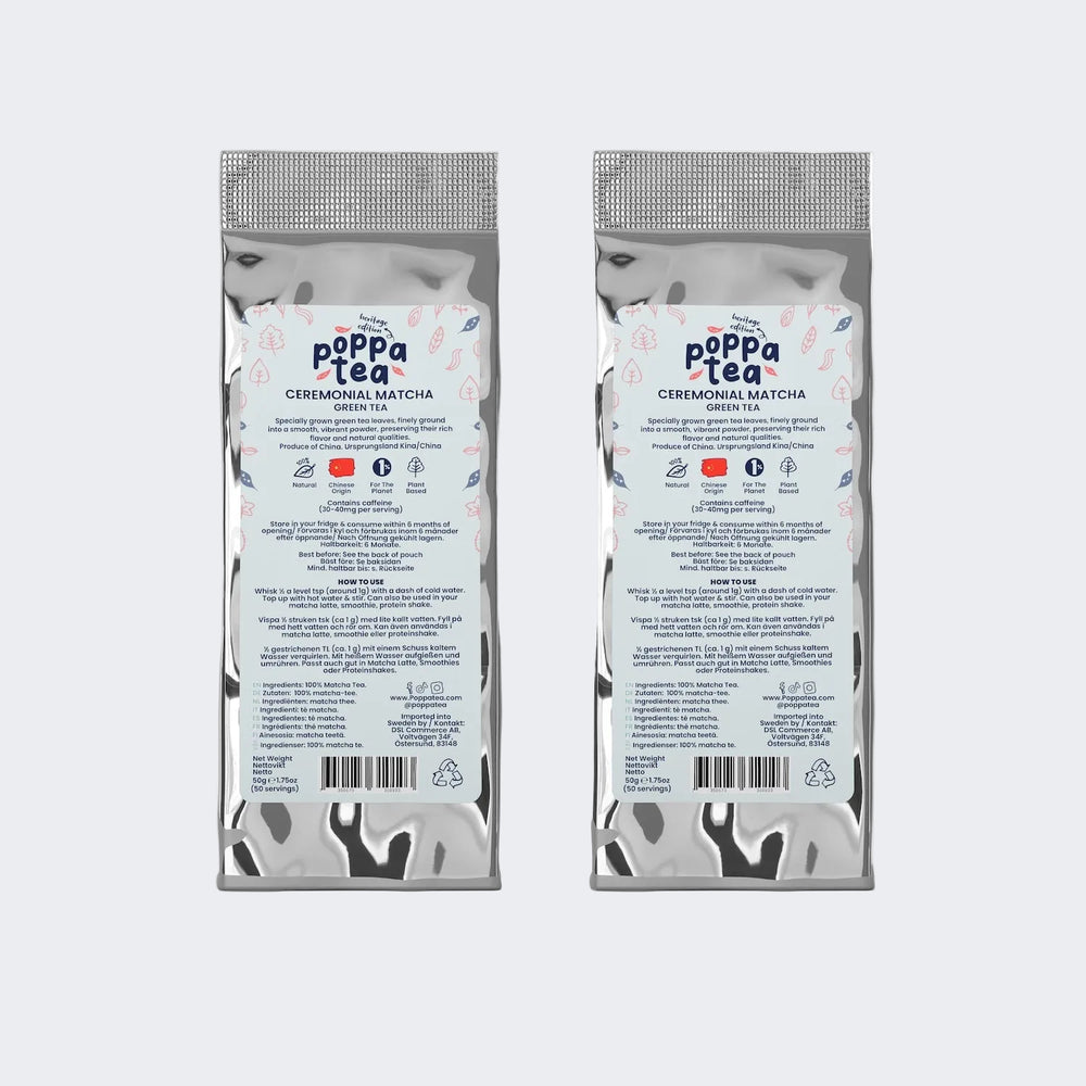 Two packages of Poppa Tea heritigae edition matcha on a white background