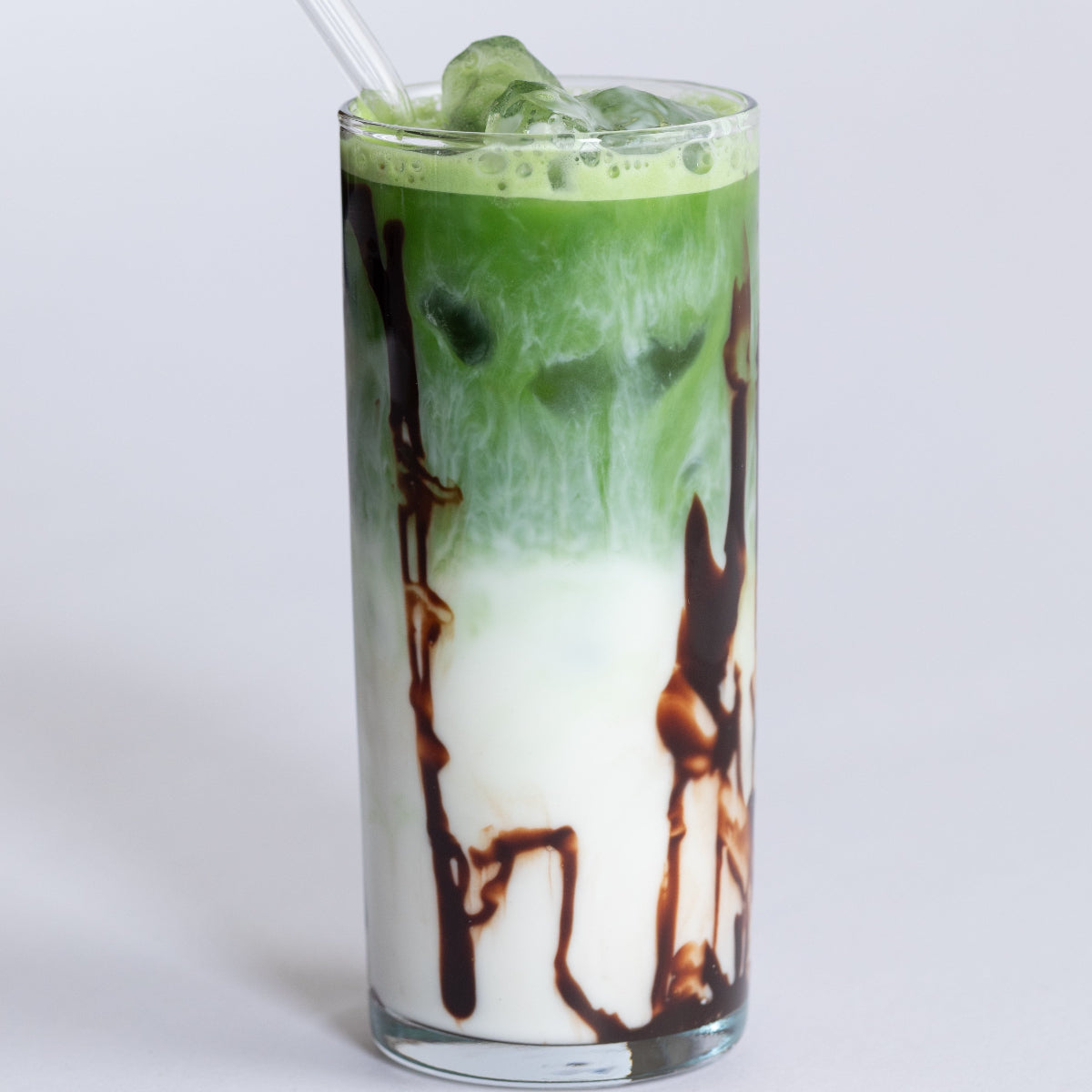 iced matcha latte with a chocolate sauce