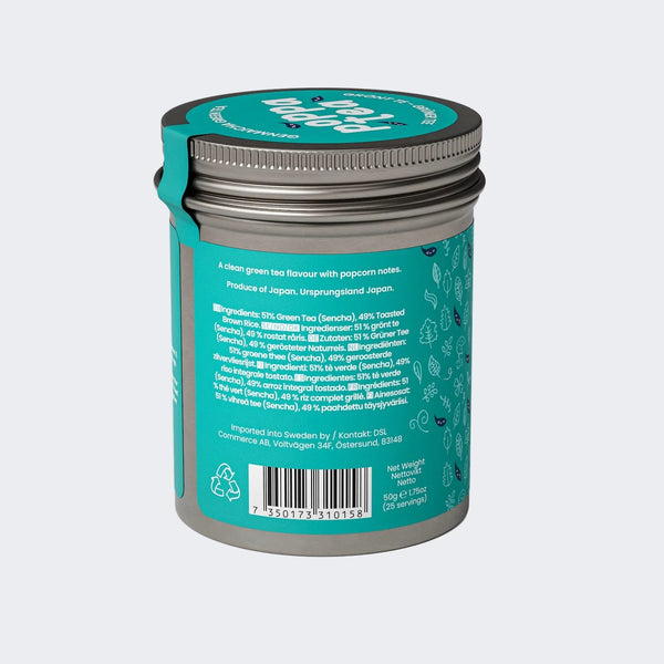 Tea canister with teal label and silver lid on a white background