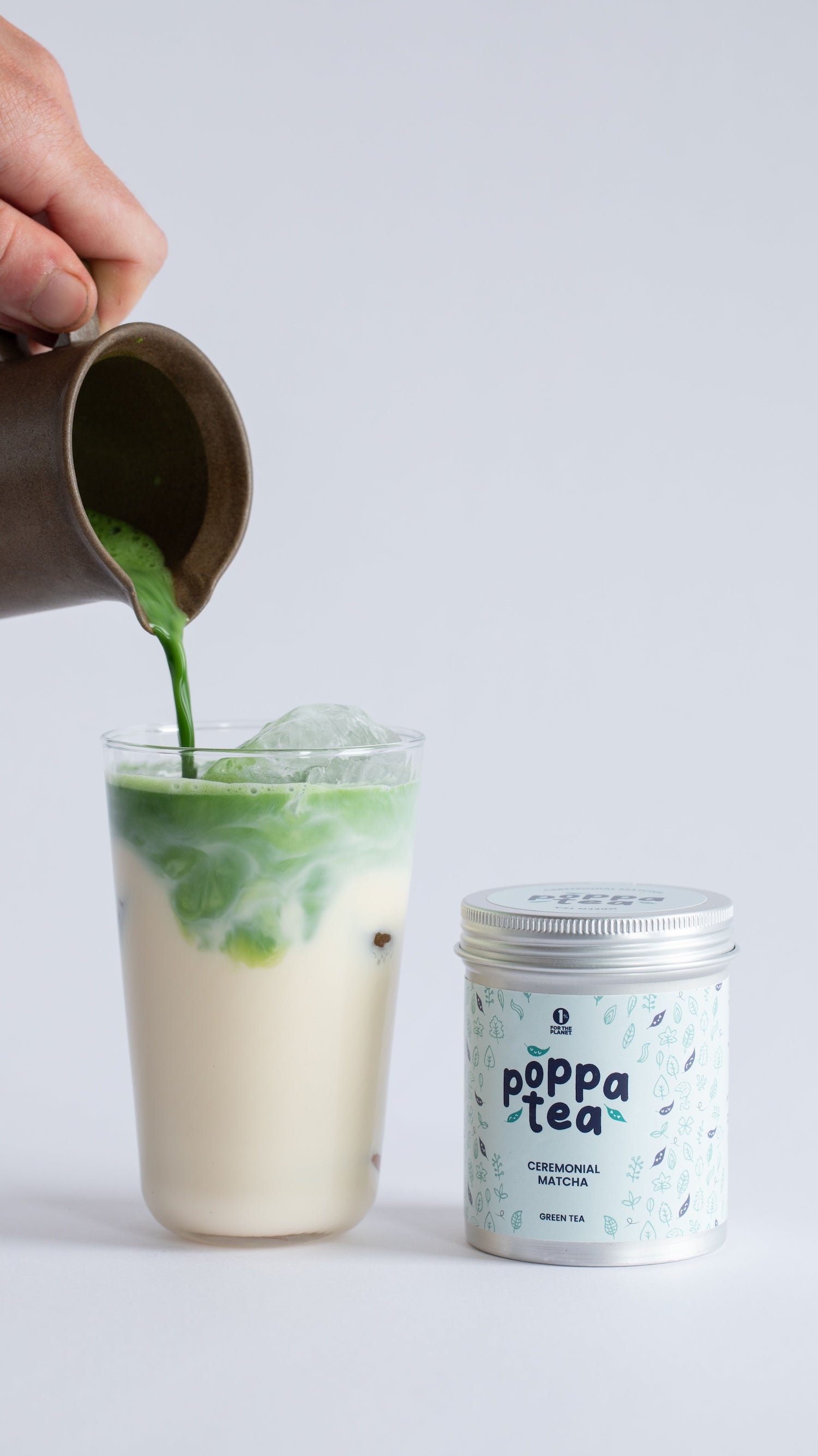poppatea ceremonial grade matcha next to an iced matcha latte