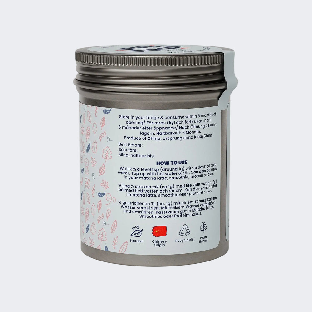 matcha green tea in a silver container with label on a white background