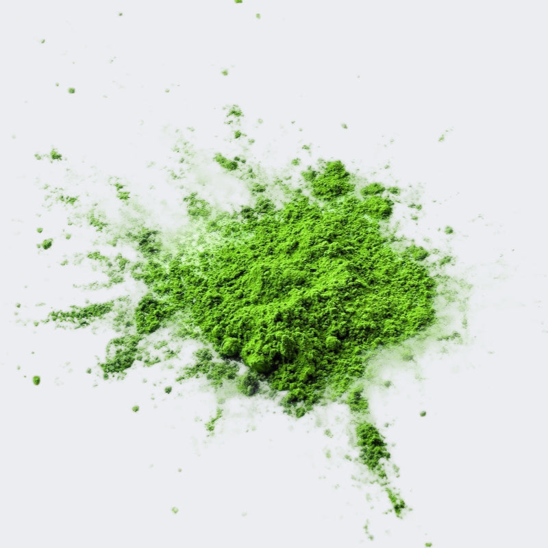 loose matcha green tea powder, a lovely vibrant green colour on a white background