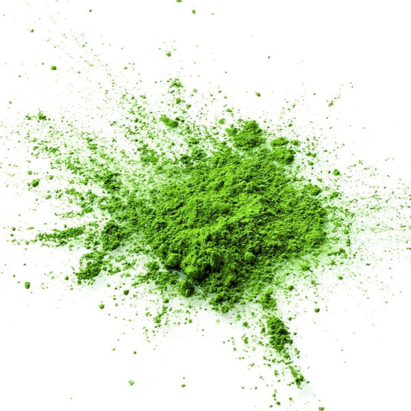loose matcha green tea powder, a lovely vibrant green colour on a white background
