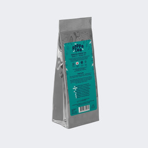 Tea package with a green label on a white background