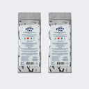Two packages of Poppa Tea heritigae edition matcha on a white background