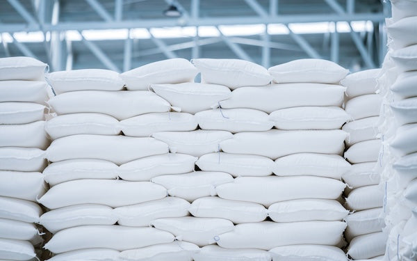 image showing large back of green tea tencha leaves being stored