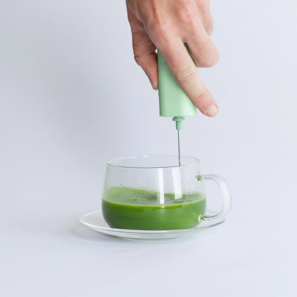 using an electric whisk to make a traditional matcha